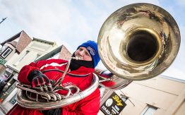 man playing bass French horn